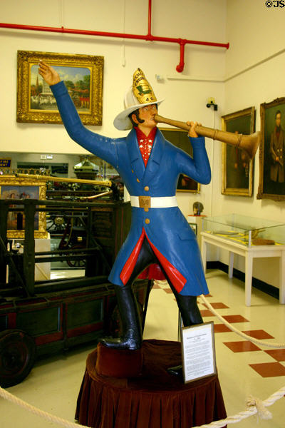 Hand-carved fire chief yelling orders through fire trumpet (c1865) from Rutgers, NY at FASNY Museum of Firefighting. Hudson, NY.