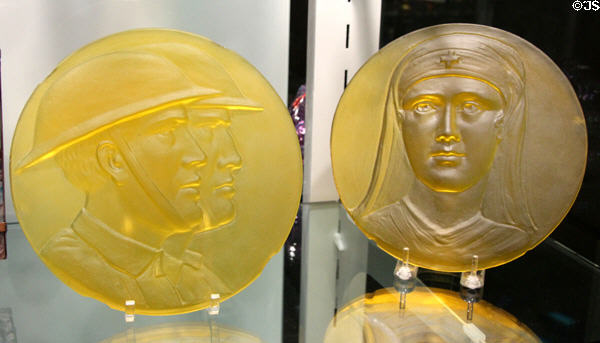 Yellow glass medallions for World War I memorial window for Corning Public Library (1930) by Frederick Carder of Steuben Glass at Corning Museum of Glass. Corning, NY.