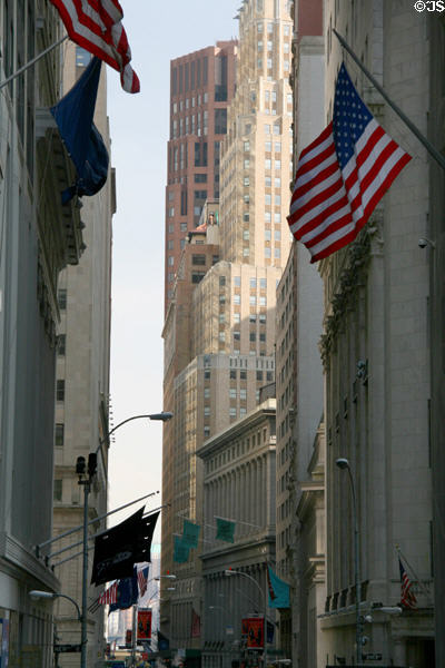 Wall Street viewed east from Trinity Church including Stock Exchange at right. New York, NY.