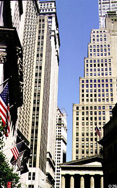 Looking up Broad Street across New York Stock Exchange & Federal Hall. New York, NY.