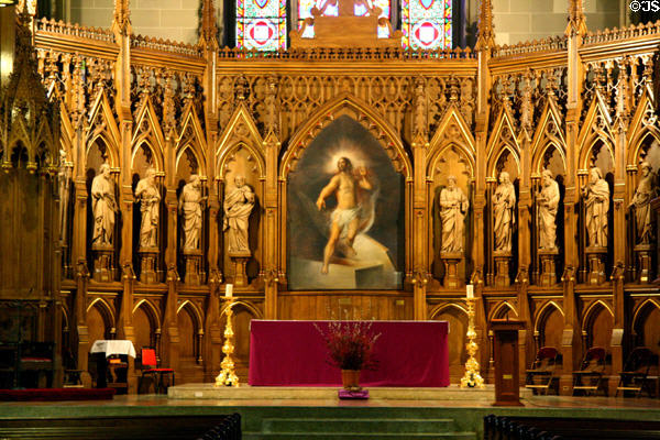 Alter screen with carved wooden disciples in St. Patrick's Old Cathedral. New York, NY.