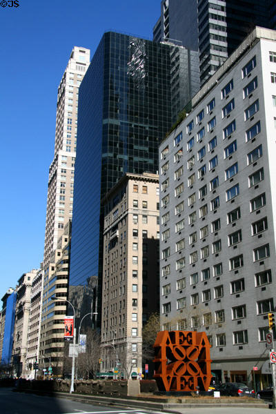 Blue windowed Banque de Paris Building (1984) (499 Park Ave. at 59th St.) (27 floors) surrounded by various highrises. New York, NY. Architect: I.M. Pei.
