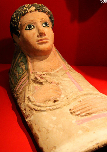 Egyptian mummy mask of youth in tunic & mantle (c140-190 CE) from Tuna el Gebel at Metropolitan Museum of Art. New York, NY.
