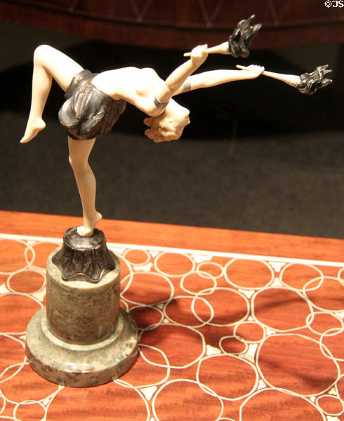 Art Deco figurine of woman with torches at Brooklyn Museum. Brooklyn, NY.