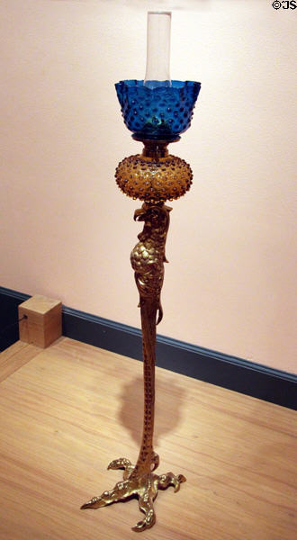 Kerosene lamp standard atop bronze bird with exaggerated claw (1886) by Pierre Emmanuel Guerin at Brooklyn Museum. Brooklyn, NY.