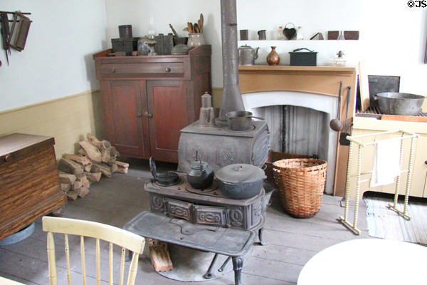 Kitchen with cast iron stove in Layton Home at Old Bethpage Village. Old Bethpage, NY.