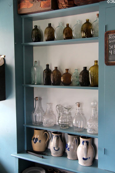 Glass bottles & decanters in Noon Inn Barroom at Old Bethpage Village. Old Bethpage, NY.