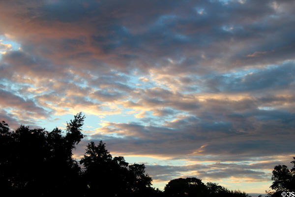 Early evening sky with sunset reflected on storm clouds. Bridgehampton, NY.