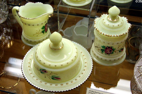 Ring Band table set in Ivorina Verde color with painted rosebuds at National Heisey Glass Museum. Newark, OH.