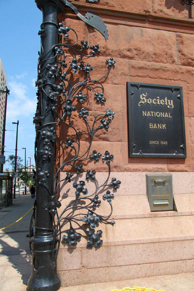 Detail of sculpted ironwork lamppost with vines on corner of Society National Bank Building. Cleveland, OH.