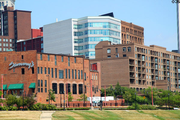 White & brown Western Reserve Building over converted warehouses across the river from The Flats. Cleveland, OH.