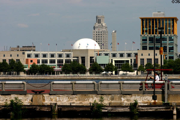 Camden City Hall (1931) with clocktower by Edwards & Green looms over white dome of New Jersey State Aquarium (1992) & One Port Center (1996) with yellow upper story. Camden, PA.