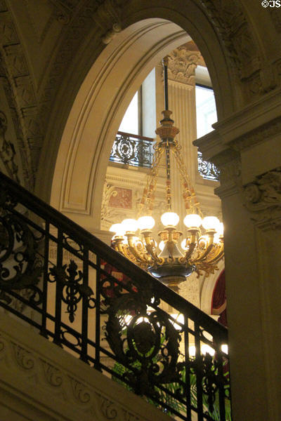 Bronze chandelier in Great Hall over stairway banister at The Breakers. Newport, RI.