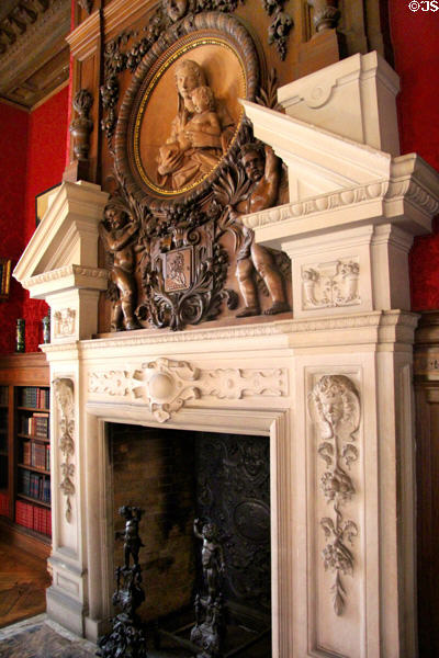 Library fireplace with Madonna & Child carving in pediment at The Elms. Newport, RI.