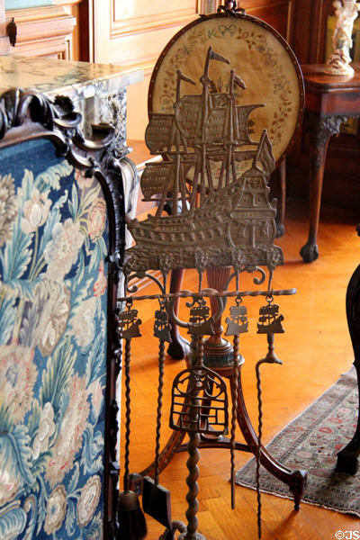 Fireplace tools on rack in shape of sailing ship at The Elms. Newport, RI.