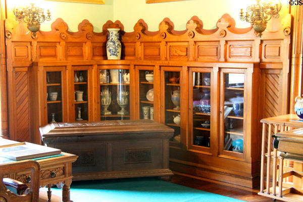 Bookcases with ceramics in billiard room at Chateau-sur-Mer. Newport, RI.
