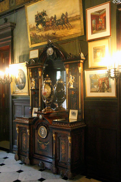 Sideboard surrounded by paintings in Marble Hall at Chateau-sur-Mer. Newport, RI.