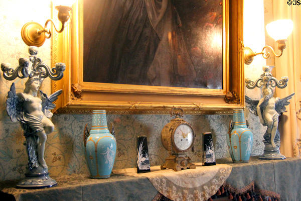 Fireplace mantle with clock, lamps & bric-a-brac at Chateau-sur-Mer. Newport, RI.