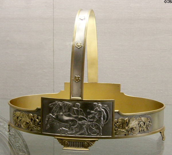 Cake basket with chariot scene (1874) by Gorham Manuf. Co. of Providence, RI at RISD Museum. Providence, RI.