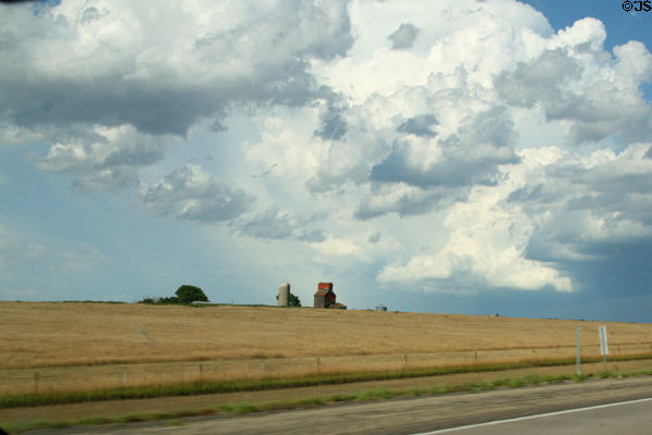 Clouds over old grain elevator. SD.