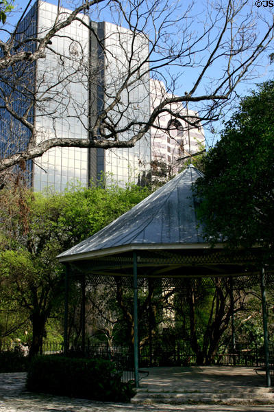 Gardens of former Ursuline Academy with highrises beyond. San Antonio, TX.