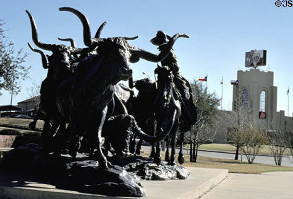 Cowboy driving steers sculpture in Stockyards National Historic District. Fort Worth, TX.