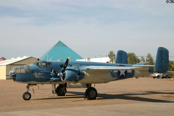 B-25 Mitchell at Lone Star Flight Museum seen against pyramids of Moody Gardens. Galveston, TX.