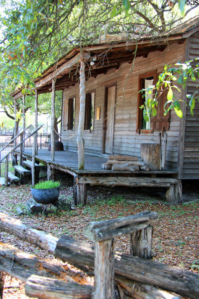 Log porch on Old Place at Sam Houston Park. Houston, TX.