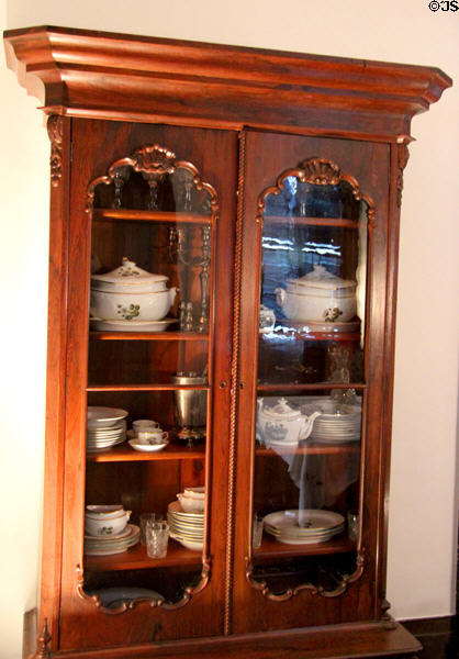 China cabinet at Nichols-Rice-Cherry House at Sam Houston Park. Houston, TX.