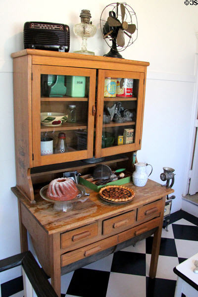 Kitchen cupboard with built-in flour bin in Staiti House at Sam Houston Park. Houston, TX.