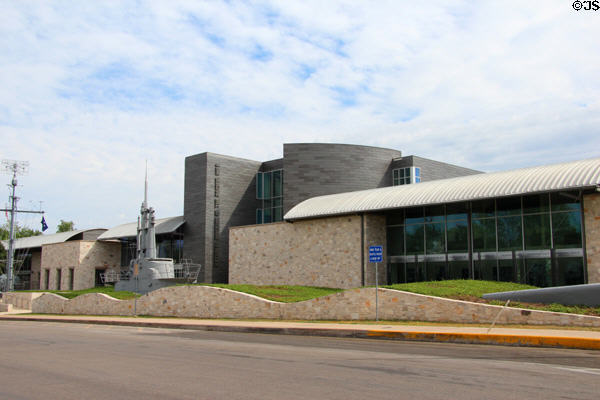 National Museum of the Pacific War building with submarine conning tower in waves of grass & stone. Fredericksburg, TX.