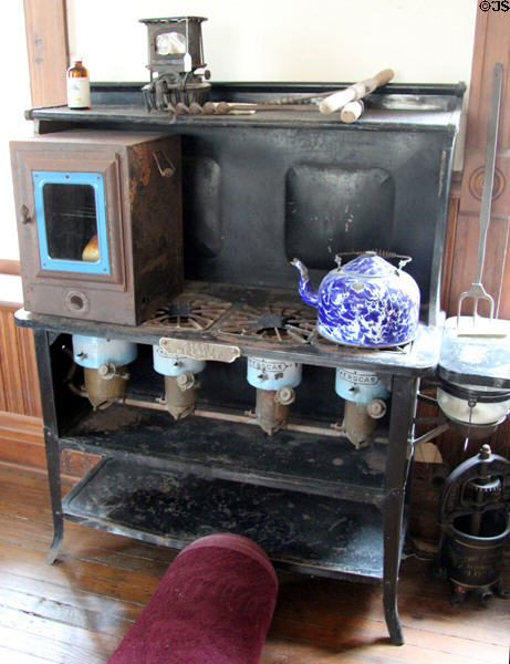 Giant Helmet stove using the Kerogas system which burns kerosene like gas plus moveable back oven over left burner at Capt. Charles Schreiner Mansion. Kerrville, TX.