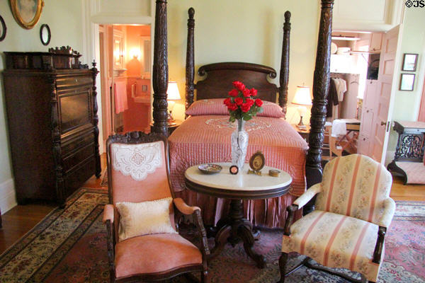 Four poster bed with carved tobacco leaf pattern in master bedroom at McFaddin-Ward House. Beaumont, TX.