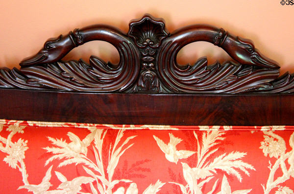 Detail of carved swans neck on Empire-style sofa's back at Neill-Cochran House Museum. Austin, TX.