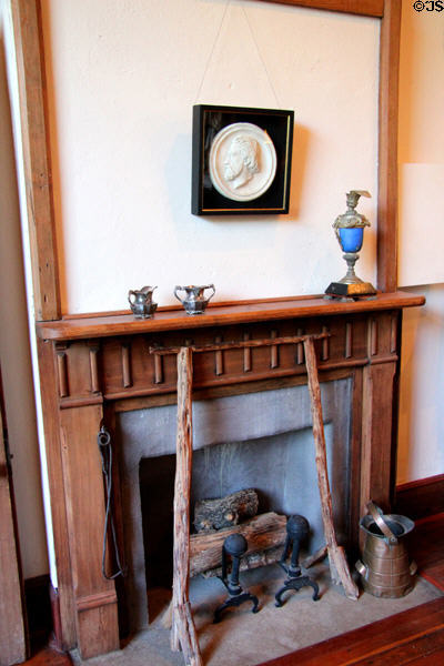 Fireplace with art critic plaster relief (1863) by Elisabet Ney at Ney Museum. Austin, TX.