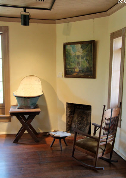 Second floor bedroom fire & simple furniture preferred by Ney at Ney Museum. Austin, TX.