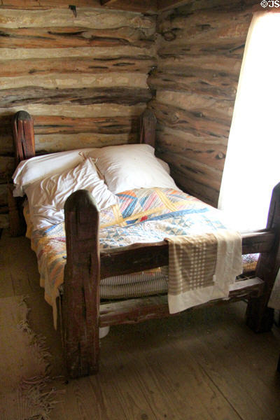 Log bedstead in Frederick Jourdan cabin at Pioneer Farms. Austin, TX.