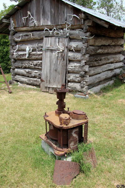 Log smokehouse with sorghum mill at Pioneer Village. Gonzales, TX.