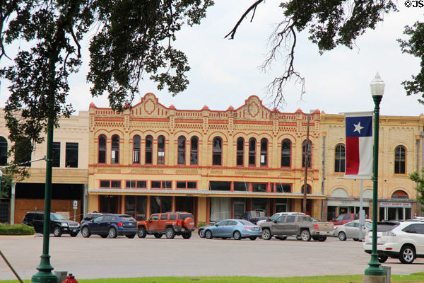 Heritage brick commercial block (c1895) (403-411 St George St.). Gonzales, TX. Style: Victorian Romanesque.