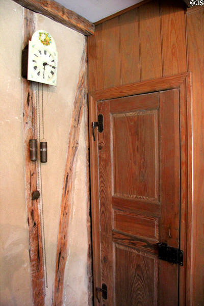 Open pendulum wall clock in Germanic style at Museum of Texas Handmade Furniture. New Braunfels, TX.