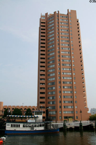 Norfolk-Portsmouth Ferry against Harbor Tower Apartments (1983) (25 floors) (One Harbor Court). Portsmouth, VA. Architect: Cossutta & Assoc..