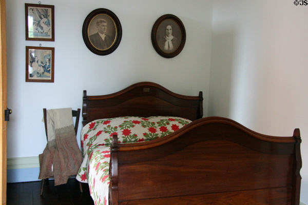 Woodrow Wilson bed under photos of his parents. Staunton, VA.