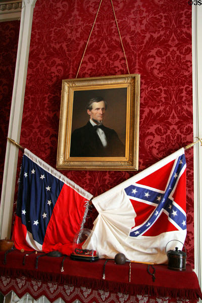 Jefferson Davis portrait over parlor fireplace with southern flags in White House of the Confederacy. Richmond, VA.