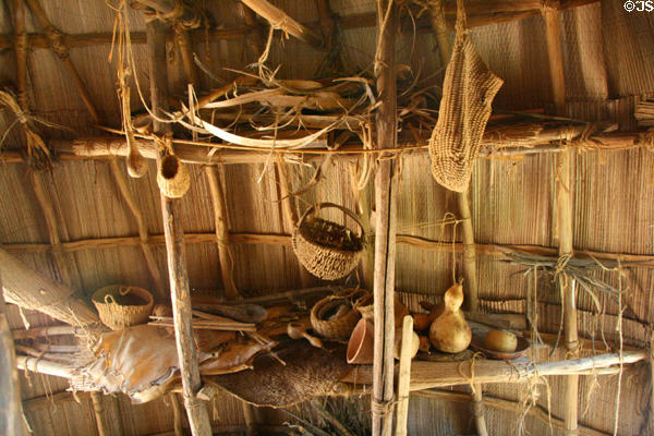 Assemblage of baskets & pots in Native American bark house in Powhatan Village at Jamestown Settlement. Jamestown, VA.