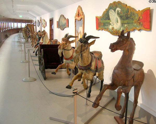 Carousel animals & signs in circus building at Shelburne Museum. Shelburne, VT.