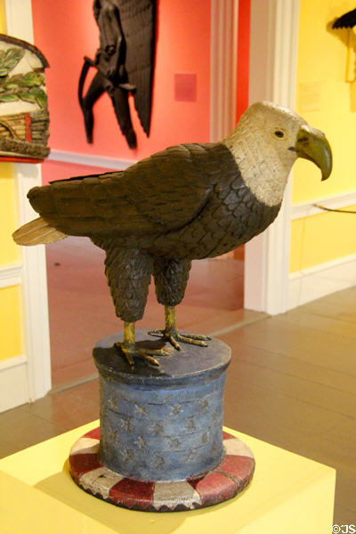 Carved wooden eagle on Uncle Sam's hat boarding house sign (late 19thC) from Pittsburgh, PA at Shelburne Museum. Shelburne, VT.