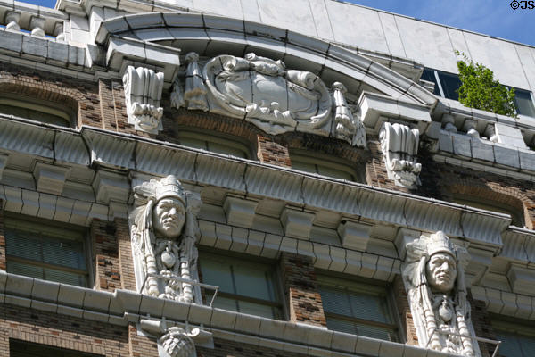 Cornice with sculpted Indians on Cobb Building. Seattle, WA.