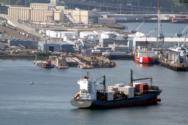 Container ship turning in front of U.S. Coast Guard Station. Seattle, WA.