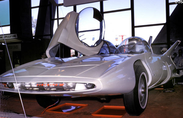 Gull-wing bubble doors of General Motors Firebird III at World of Tomorrow in Washington State Coliseum at Century 21 Exposition. Seattle, WA.