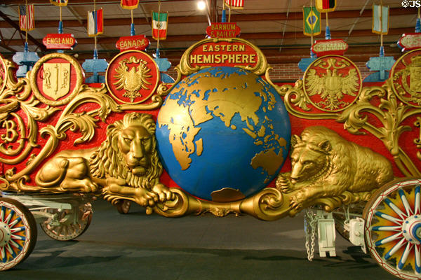 Carved lion & bear flanking globe detail of Eastern Hemisphere circus wagon at Circus World Museum. Baraboo, WI.